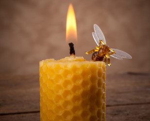 burning beeswax candle