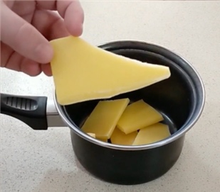 melting beeswax in pot